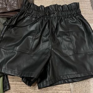 Black faux leather shorts